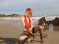 Lyza, the redhead that strips off in red sexy bodysuit on the beach

