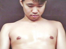 A handsome Asian guy caresses himself in front of his camera!