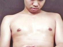 A handsome Asian guy caresses himself in front of his camera!