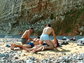 Gay couple having sex at the seaside