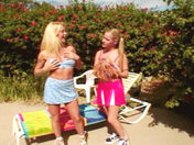 2 lesbian girls by the swimming pool!